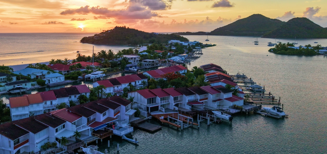 Jolly Harbour marina and waterfront villas at sunset, Antigua