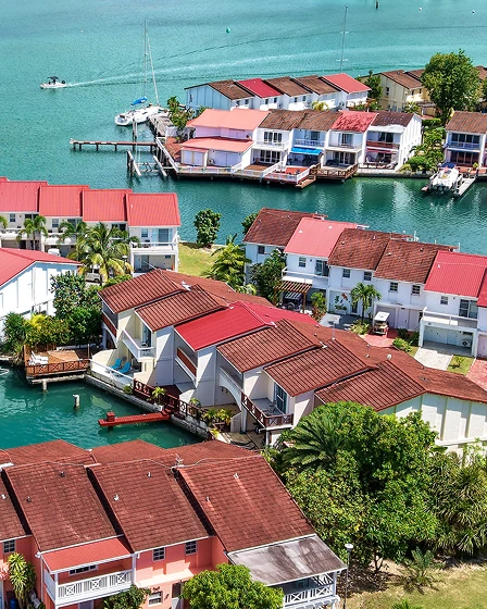 Aerial view of Jolly Harbour’s waterfront villas with private boat docks