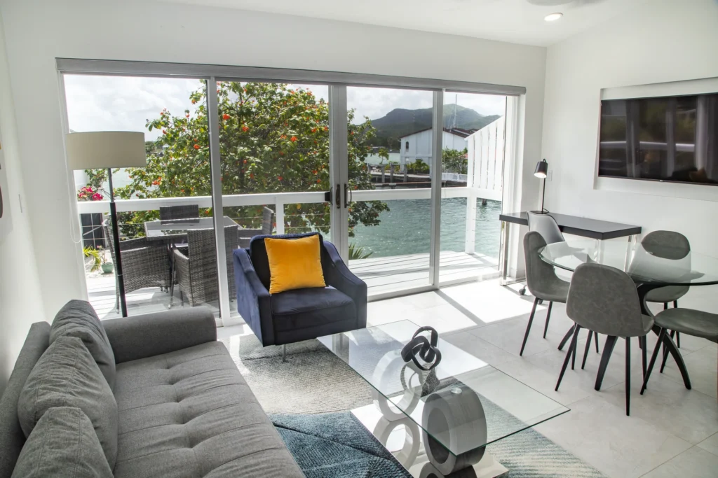 One Bedroom Luxury villa living and dining area with balcony and marina view